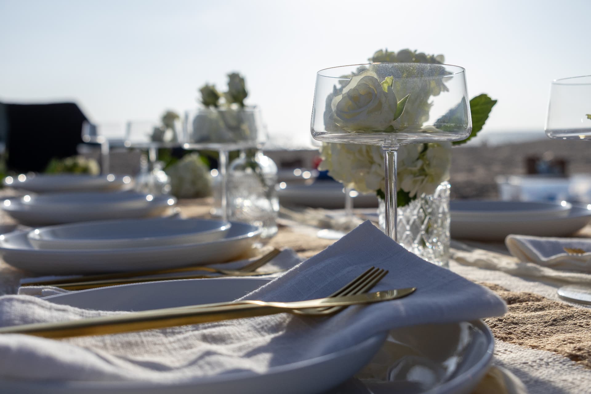Elegant Picnella table setting beside the ocean